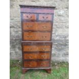A mahogany and walnut tallboy, fitted with two short drawers over two long drawers to the top