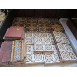 A collection of 19th century encaustic tiles, including gothic revival designs in the style of