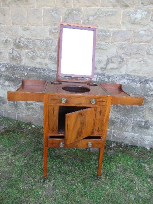 A 19th century mahogany folding pot cupboard / dressing table, the top opening to reveal apertures