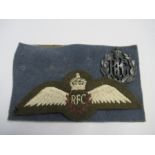 World War 1, a Royal Flying Corps cloth badge on khaki felt, together with a blue metal RFC badge