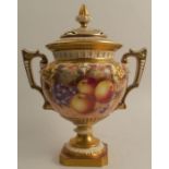 A Royal Worcester covered vase, decorated all around with hand painted fruit by Freeman, raised on a