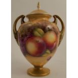 A Royal Worcester covered pedestal vase, decorated all around with fruit to a mossy background by