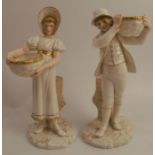 A pair of Royal Worcester figures, of a boy and a girl carrying baskets by a tree stump, in white