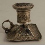 A late 19th century German Hanau silver miniature chamberstick, of square form, with a pattern of
