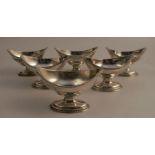 A set of six Georgian silver salts, of oval form, with bead edge, raised on an oval pedestal foot,