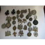 A quantity of British Infantry Regiments of the Line Cap Badges, to include Manchester, Artists,