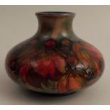 A Moorcroft squat vase, decorated in the Leaf and Berry pattern, script and impressed mark to the