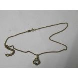 A 9 carat gold emerald pendant, on a chain, 4g gross