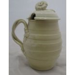 An 18th century Leeds creamware covered mustard pot, of barrel form with moulded body, with entwined