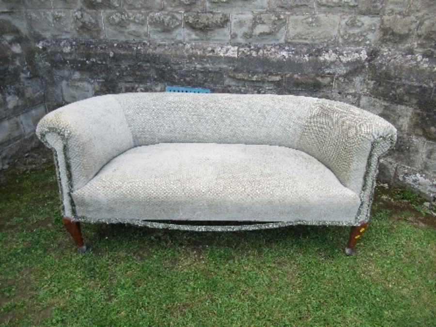 A two seater sofa, raised on short cabriole legs, width 60ins x depth 28ins x height 26in