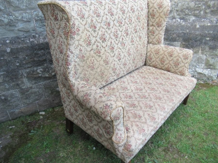 A high backed wing back two seater settee, the floral upholstery, width 53ins x height 47ins - Image 2 of 5