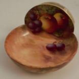 A Royal Worcester strike holder, decorated with fruit to a mossy background by Aryton, minor crazing