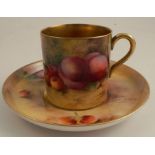 A Royal Worcester coffee can and saucer, painted to the exterior of the can and the saucer with