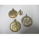 Four hallmarked gold pendants, 10.4g gross