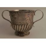 A 17th century Britannia standard silver two handled pedestal cup, with gadrooned lower body and