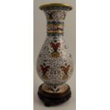 A 20th century cloisonne vase, of baluster form, decorated in the Persian style to a white ground,