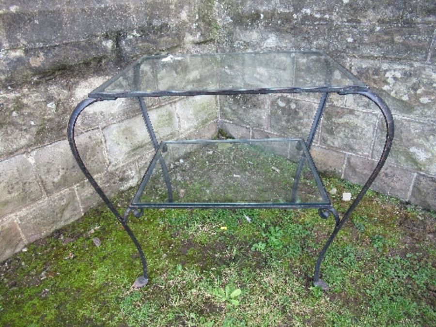 A Bromsgrove Guild glass top table, with wrought iron base, 18ins x 24ins x height 25ins