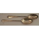 A pair of silver basting spoons, with rat tail bowls, engraved with a crest, London 1909, maker