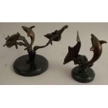 Two 20th century bronze models, of dolphins swimming, on circular marble bases, heights 5.5ins and