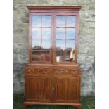A 19th century design mahogany glazed cabinet, the upper section having glazed doors opening to