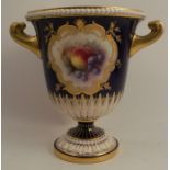 A Royal Worcester twin handled pedestal vase, decorated with a vignette of fruit by R Seabright,