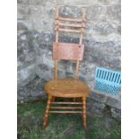 An unusual Arts and Crafts style high ladder back oak chair, max height 49ins, seat width 19ins