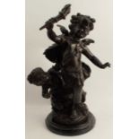 A bronze figure, of a blind folded cherub holding a flaming torch, with another figure looking up,