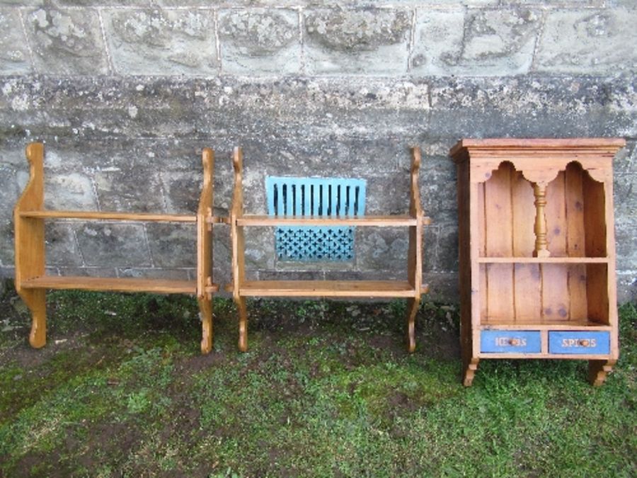 A hanging pine cabinet, width 19ins, together with two hanging sets of shelves, width 27ins