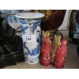 An Oriental blue and white vase, of cylindrical form with flared rim, character marks to the base,