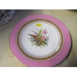 A 19th century Royal Worcester plate, decorated with a spray of flowers, with pink border,