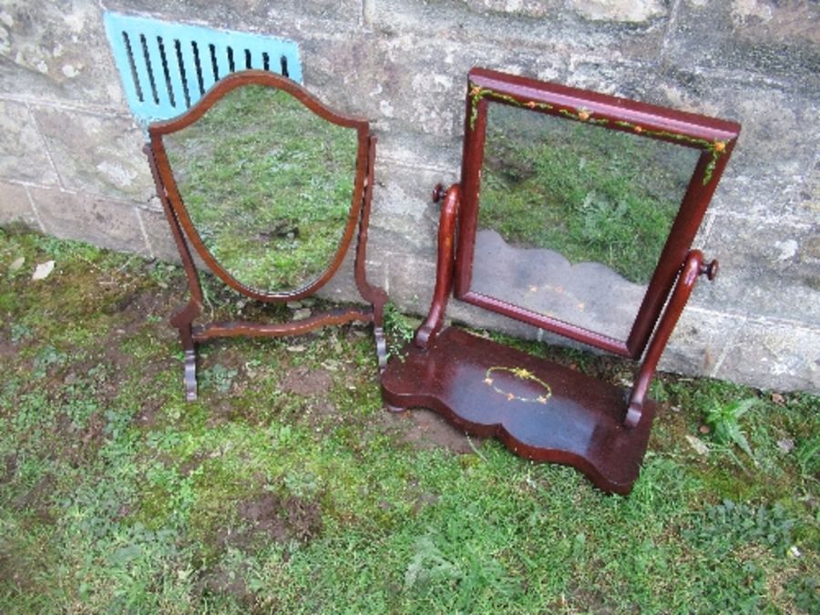 Two swing frame toilet mirrors, one with painted floral decoration