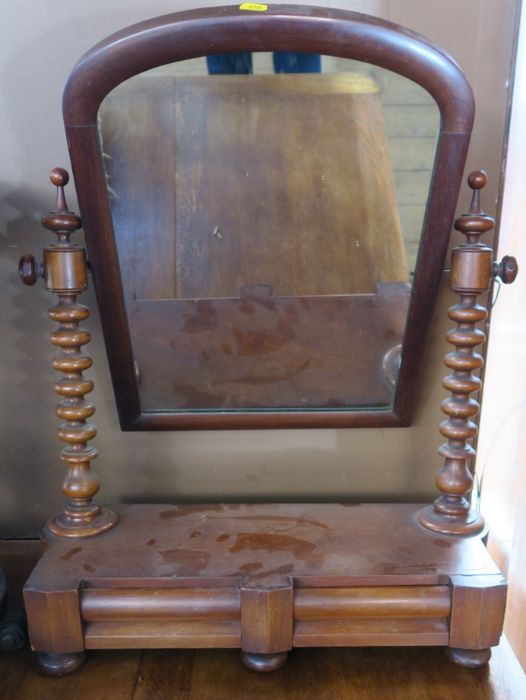 A Victorian mahogany swing frame toilet mirror, with barley twist supports, fitted with drawers to