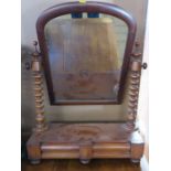 A Victorian mahogany swing frame toilet mirror, with barley twist supports, fitted with drawers to