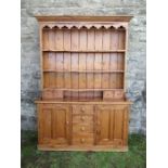 A pine dresser, with plate rack over, width 70ins x depth 16ins x height 84ins