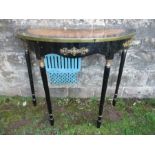 A painted console table, with inlay decoration and applied metal mount, one leg broken, width