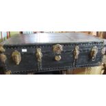 A black trunk, with brass corners, 40ins x 23ins x 12ins