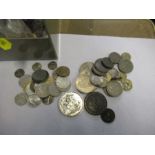 A collection of coins, to include English and European