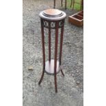 A small mahogany plant stand, of circular form, with pierced decoration