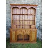 A pine dresser, with arcaded upper section, width 70ins x depth 16ins x height 84ins