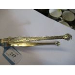 A pair of Georgian silver sugar tongs, with bright cut decoration