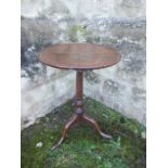 A Georgian dish top oak tripod table, diameter 19ins x height 26ins