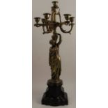 A 19th century gilt metal five light candelabrum, the Aesthic style branches supported by a female