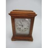A modern cased striking mantle clock, with square silvered dial, height 11ins