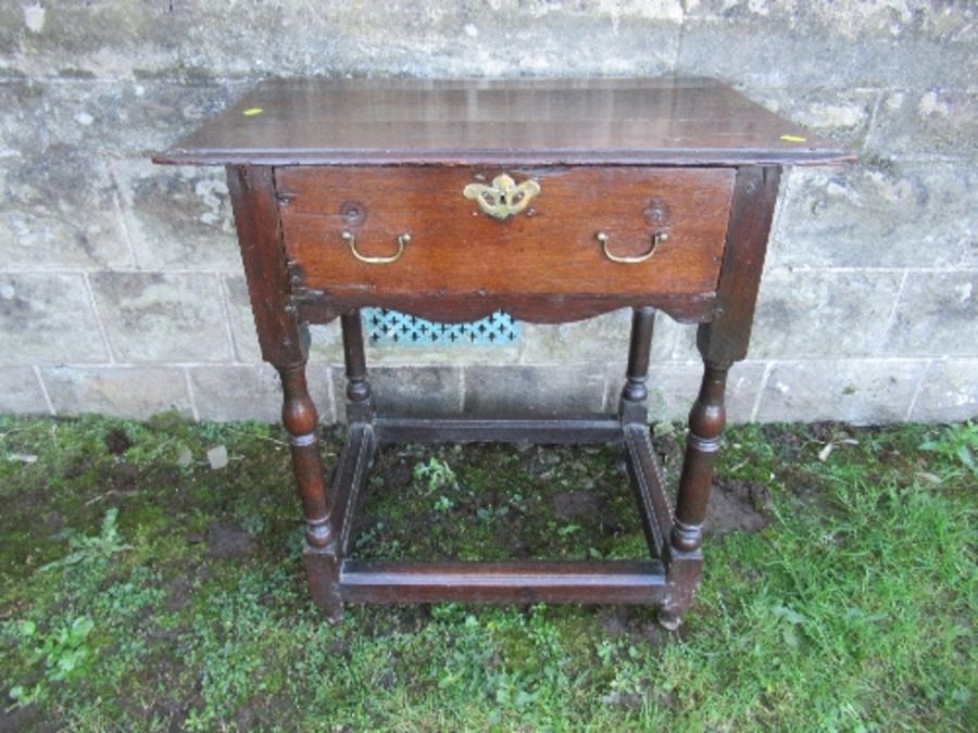 An antique oak side table, fitted with a single drawer, width 27ins x depth 18.5ins x height 29ins