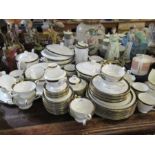 A Royal Worcester Mountbatten dinner service, comprising, covered tureens, tea pot, cups, saucers,