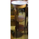 A mahogany plant stand, with circular top and two shelves under, diameter of top 13ins, height