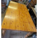 A large pine kitchen table, 84ins x 47ins, height 30ins