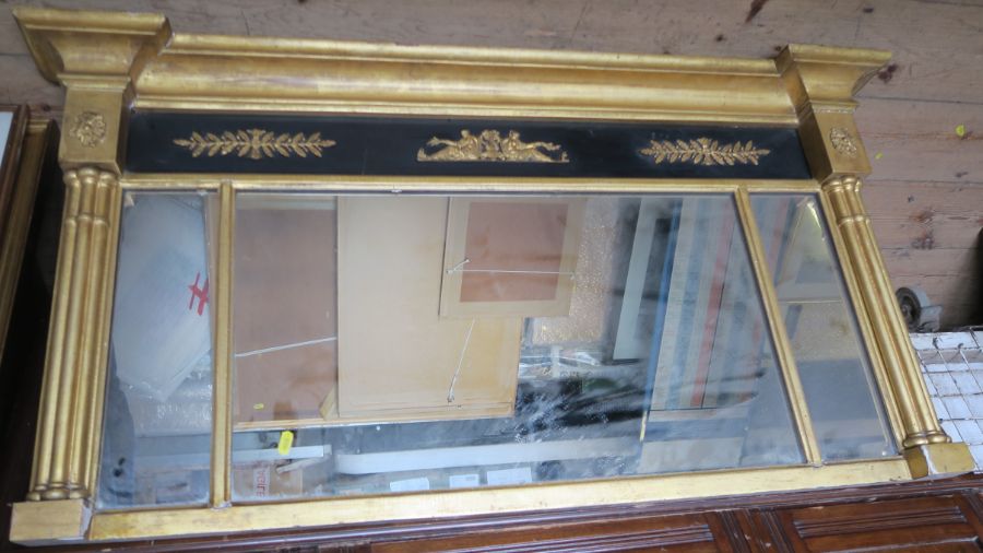 A 19th century over mantel mirror, with cluster columns to the side, the frieze decorated with