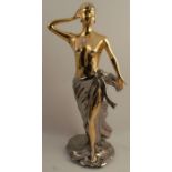 A 20th century Italian porcelain figure of a semi naked female in gold and silver, height 24ins,