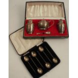 A cased set of silver coffee bean spoons, Chester 1932, together with a cased silver three piece